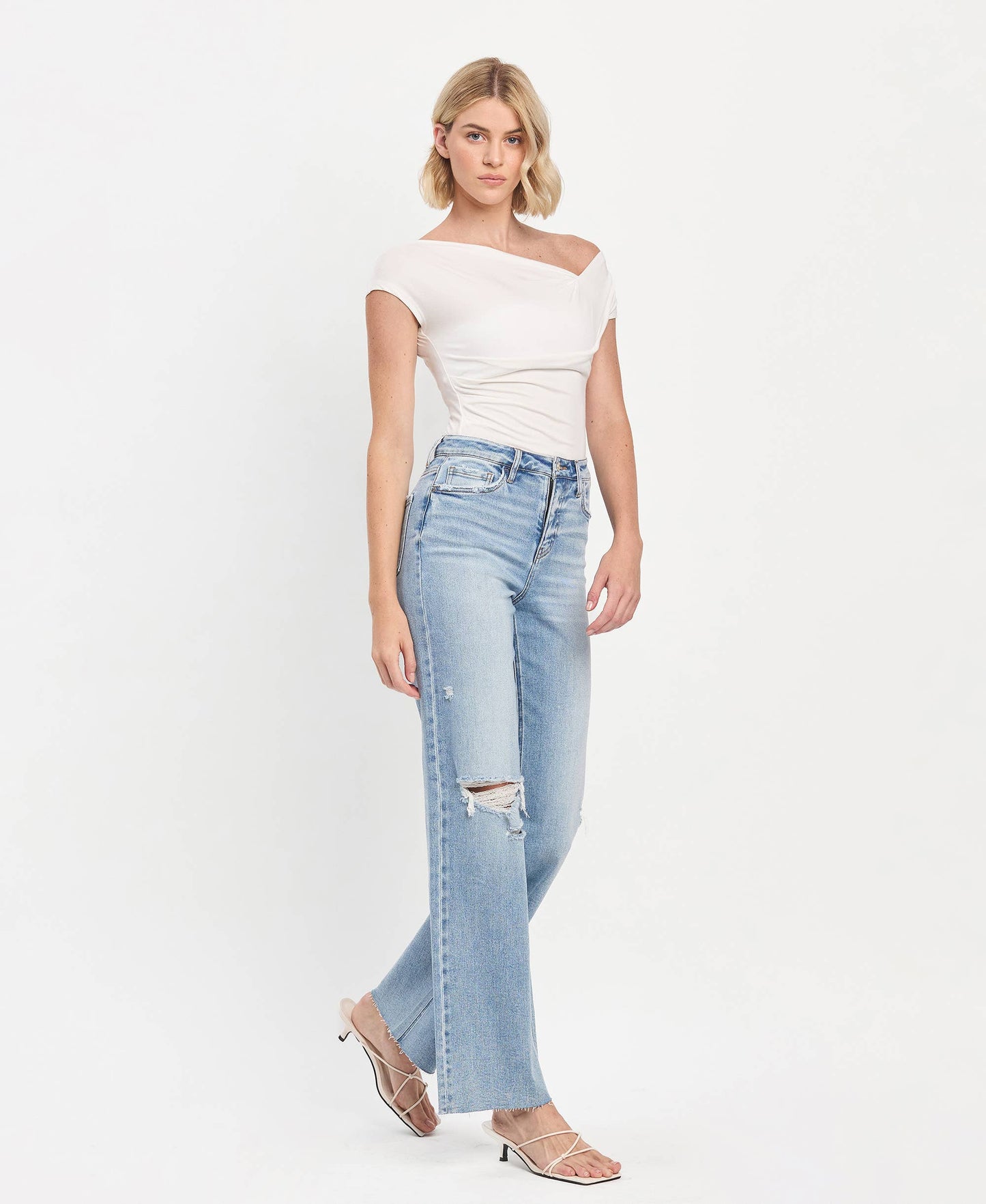 Refulgent High rise Clean Cut raw hem wide leg jeans