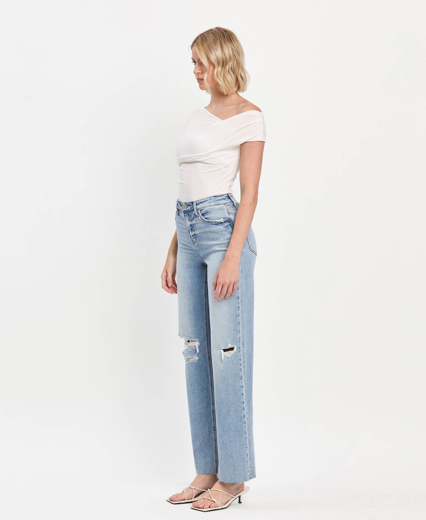 Refulgent High rise Clean Cut raw hem wide leg jeans