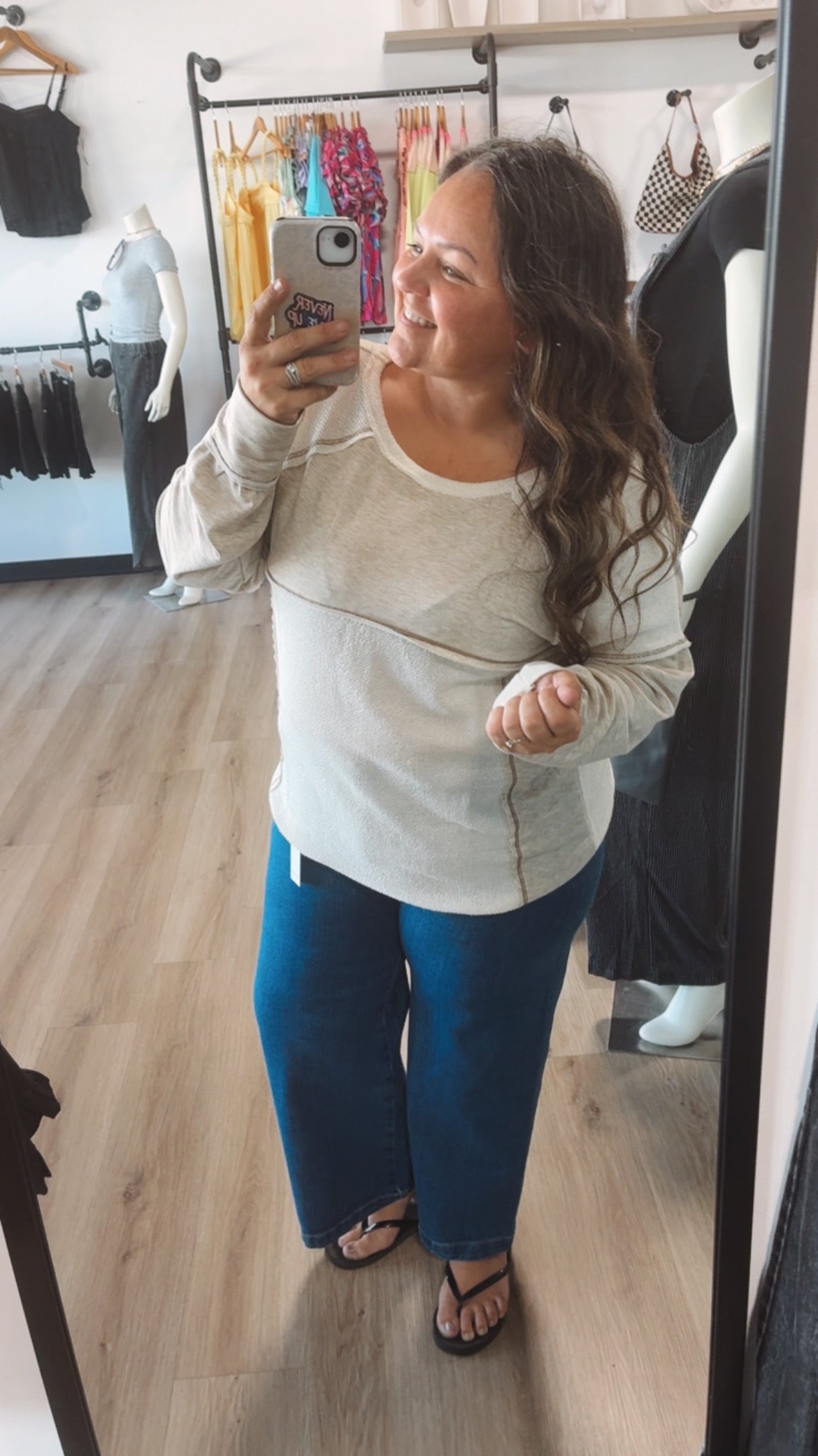 Exposed hem creamy long sleeve top