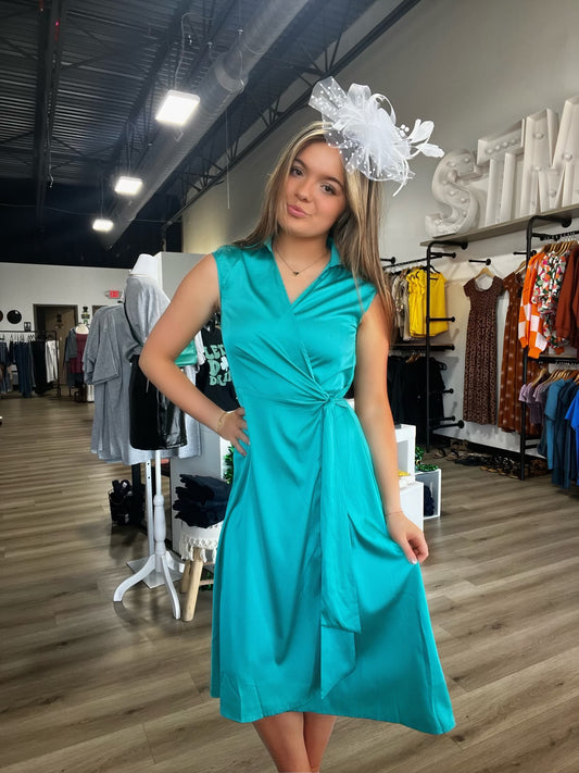 Amelia’s open back turquoise midi wrap dress