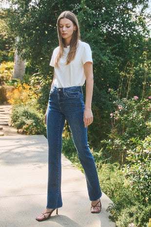 Haylie’s high rise slim bootcut raw hem jeans