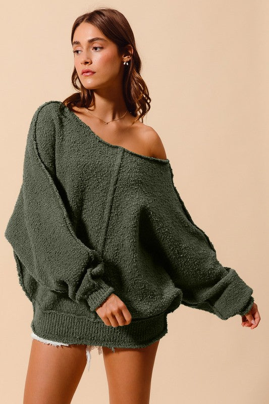 Emma’s exposed stitch wide neck sweater